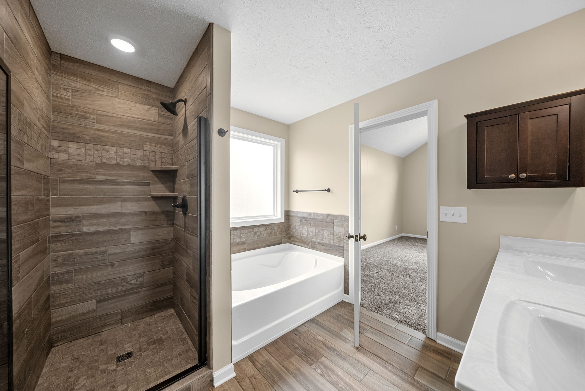 1227 Brigade Drive Clarksville, TN 37043 - Photo 19 of 39 a bathroom with a bathtub and a shower