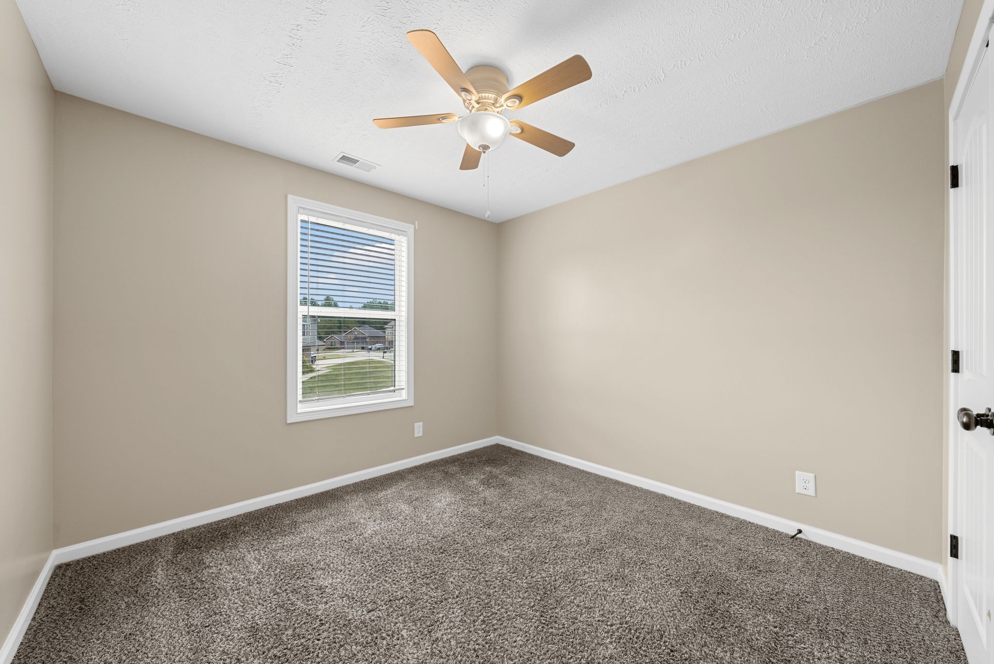 1227 Brigade Drive Clarksville, TN 37043 - Photo 21 of 39 an empty room with a ceiling fan and window