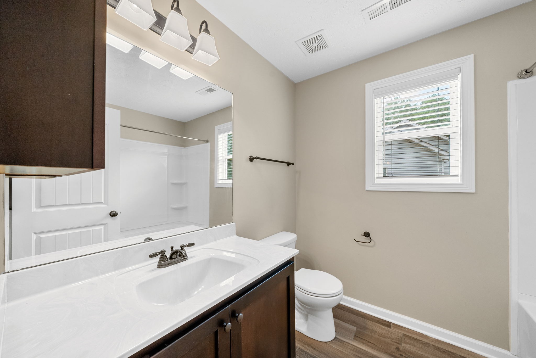 1227 Brigade Drive Clarksville, TN 37043 - Photo 23 of 39 a bathroom with a sink a toilet and mirror