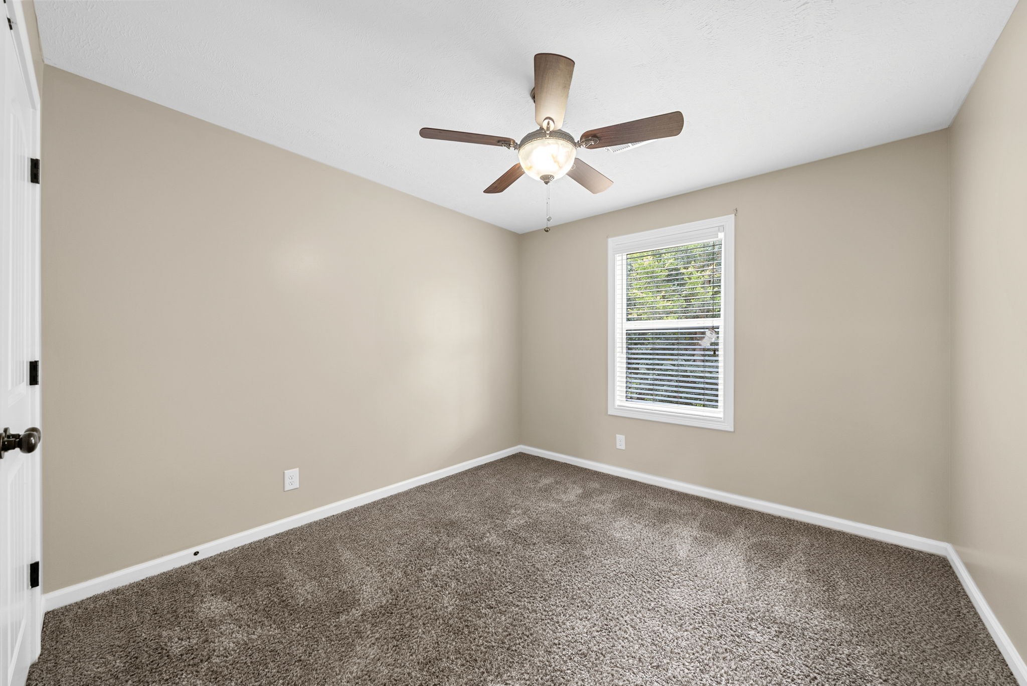 1227 Brigade Drive Clarksville, TN 37043 - Photo 24 of 39 an empty room with a window and a fan