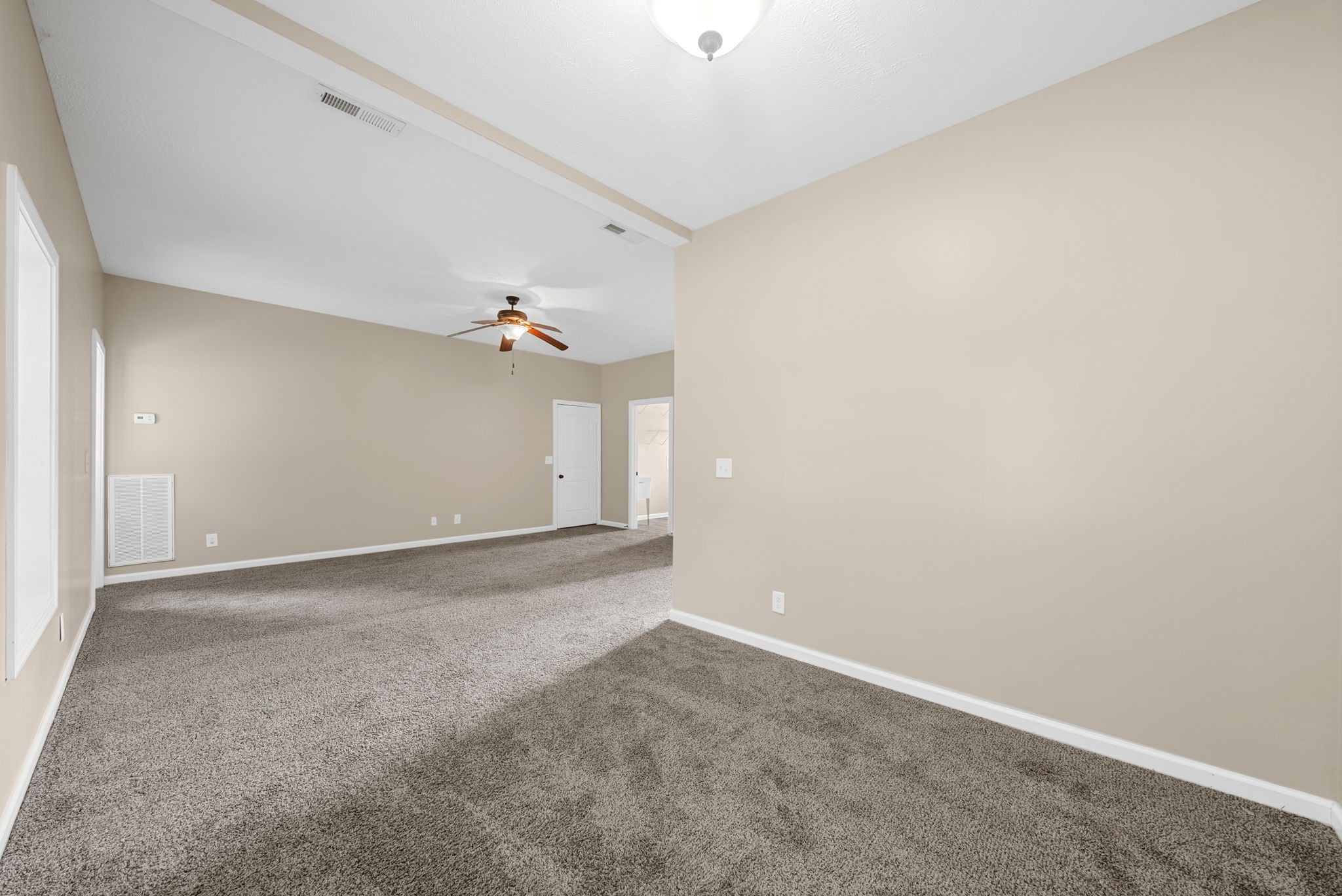 1227 Brigade Drive Clarksville, TN 37043 - Photo 29 of 39 an empty room with a chandelier fan and wooden floor