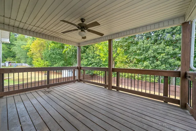 a view of a house with a swimming pool and a yard