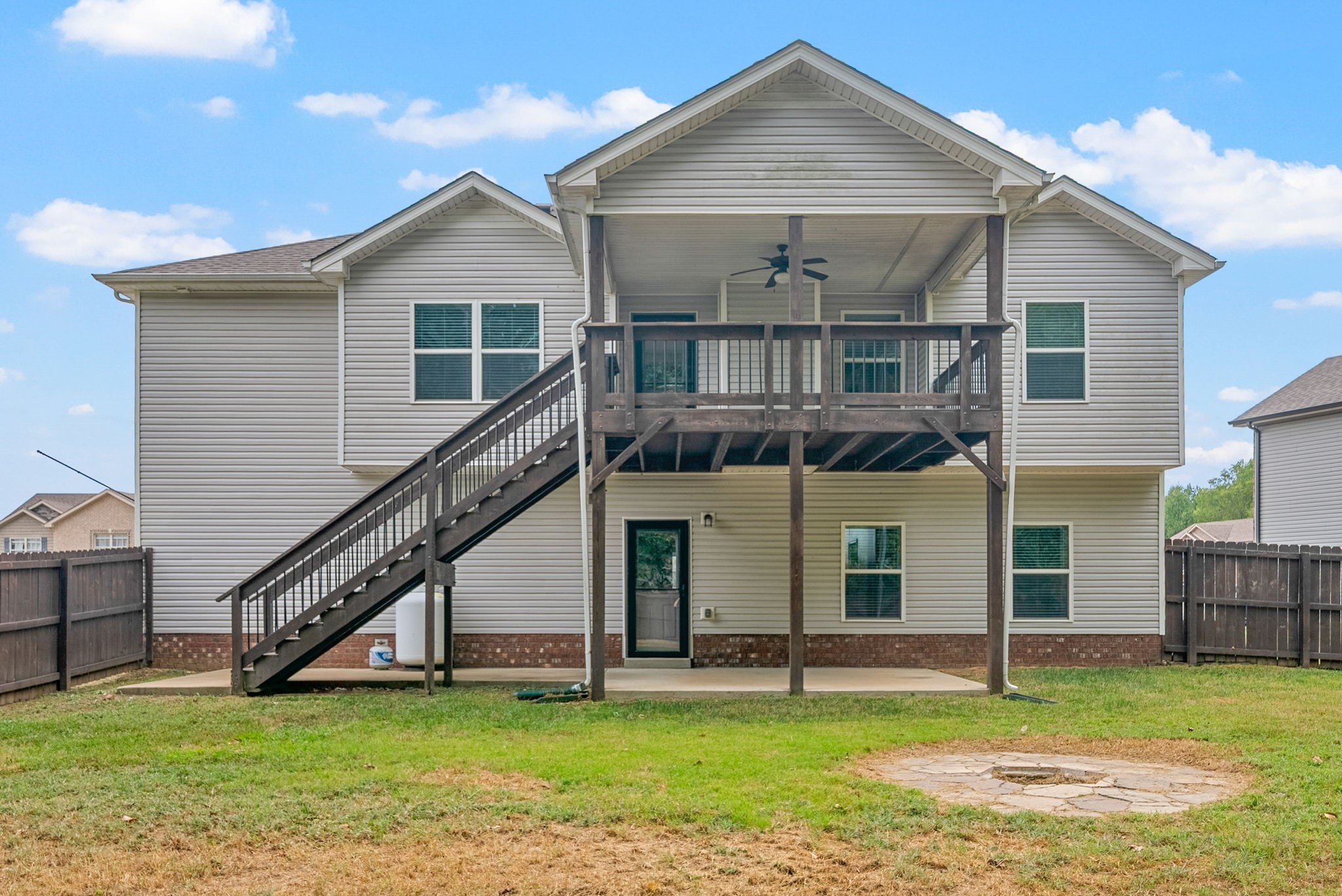1227 Brigade Drive Clarksville, TN 37043 - Photo 35 of 39 a view of a house with a swimming pool and a yard