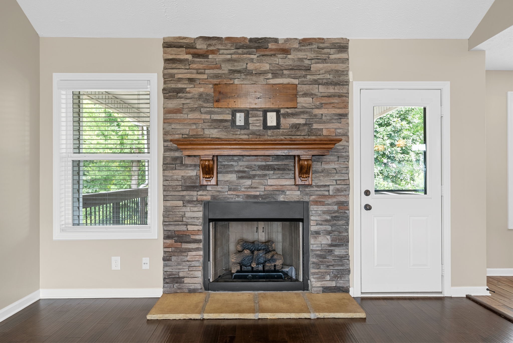 1227 Brigade Drive Clarksville, TN 37043 - Photo 5 of 39 a living room with a fireplace and windows