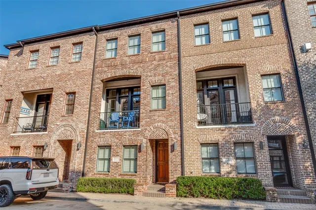 a front view of a building with parking space