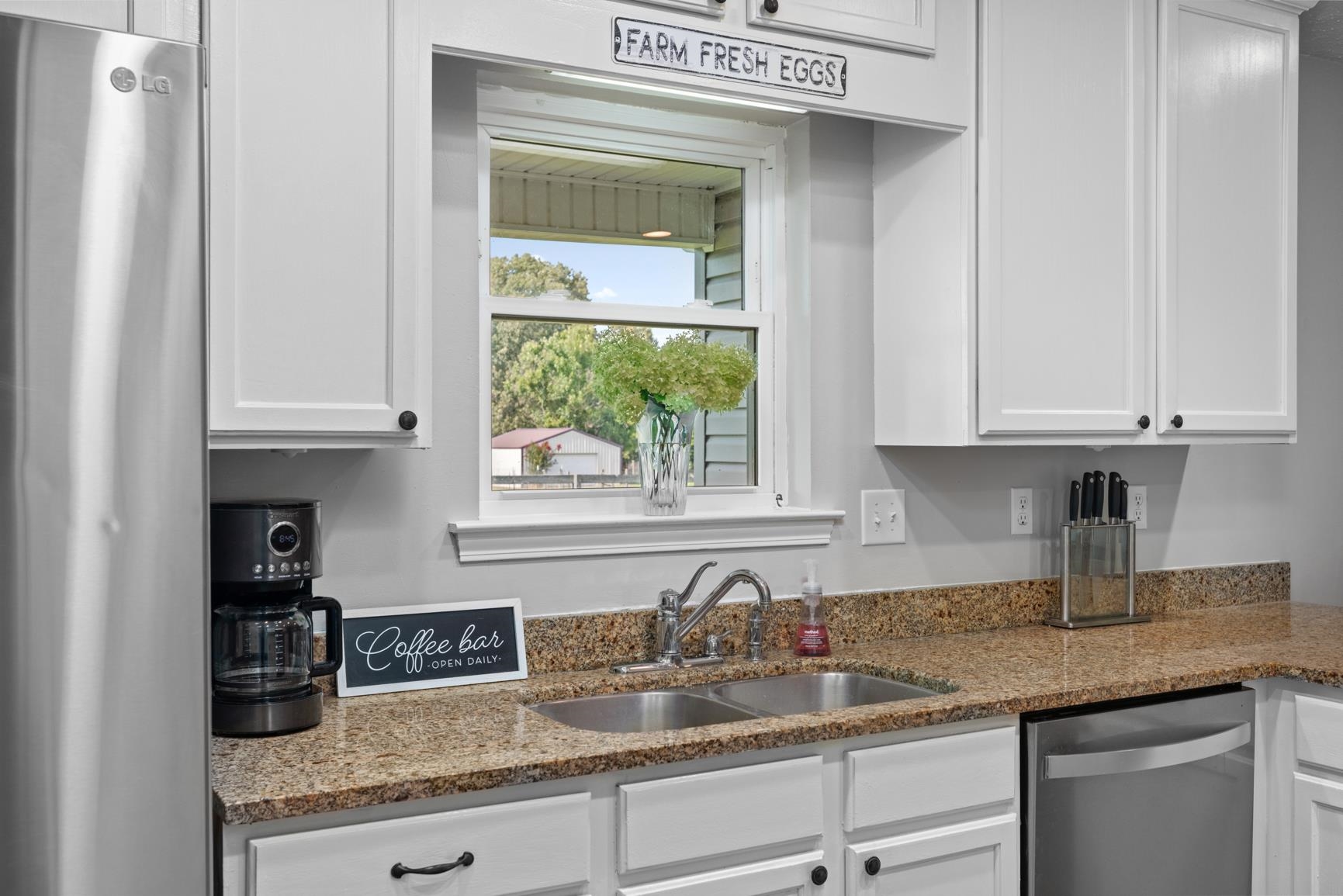 2640 Brighton-Clopton Road Brighton, TN 38011 - Photo 15 of 36 Kitchen featuring stainless steel appliances, white cabinets, and light stone counters