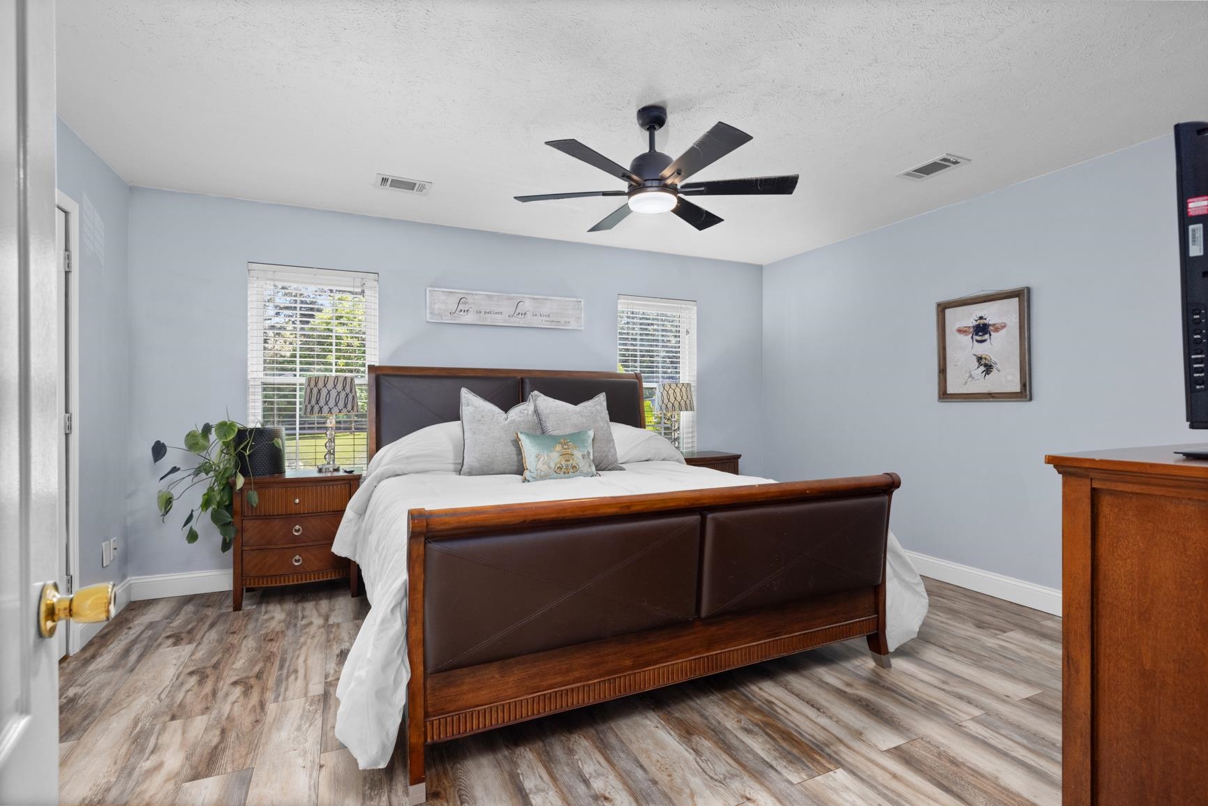 2640 Brighton-Clopton Road Brighton, TN 38011 - Photo 18 of 36 Bedroom featuring wood finished floors, a textured ceiling, and ceiling fan