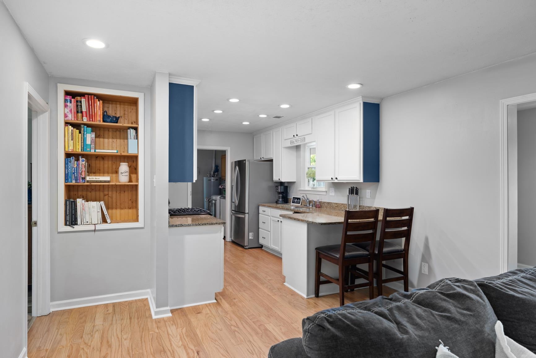 2640 Brighton-Clopton Road Brighton, TN 38011 - Photo 36 of 36 Kitchen featuring white cabinetry, light wood-style floors, open floor plan, light stone countertops, and recessed lighting