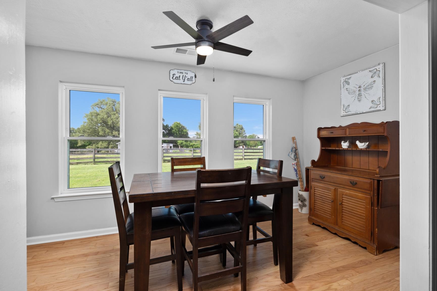 2640 Brighton-Clopton Road Brighton, TN 38011 - Photo 9 of 36 Dining area with light wood-type flooring, healthy amount of natural light, and ceiling fan
