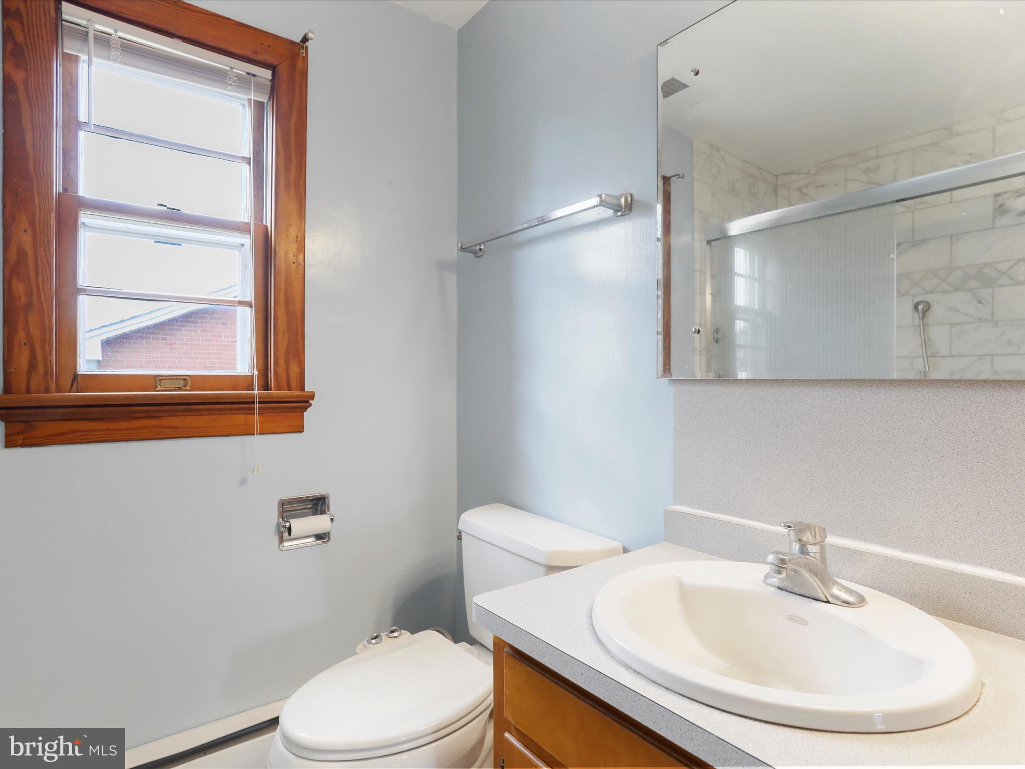 211 Broad Street Middletown, MD 21769 - Photo 14 of 35 a bathroom with a sink a toilet and a mirror