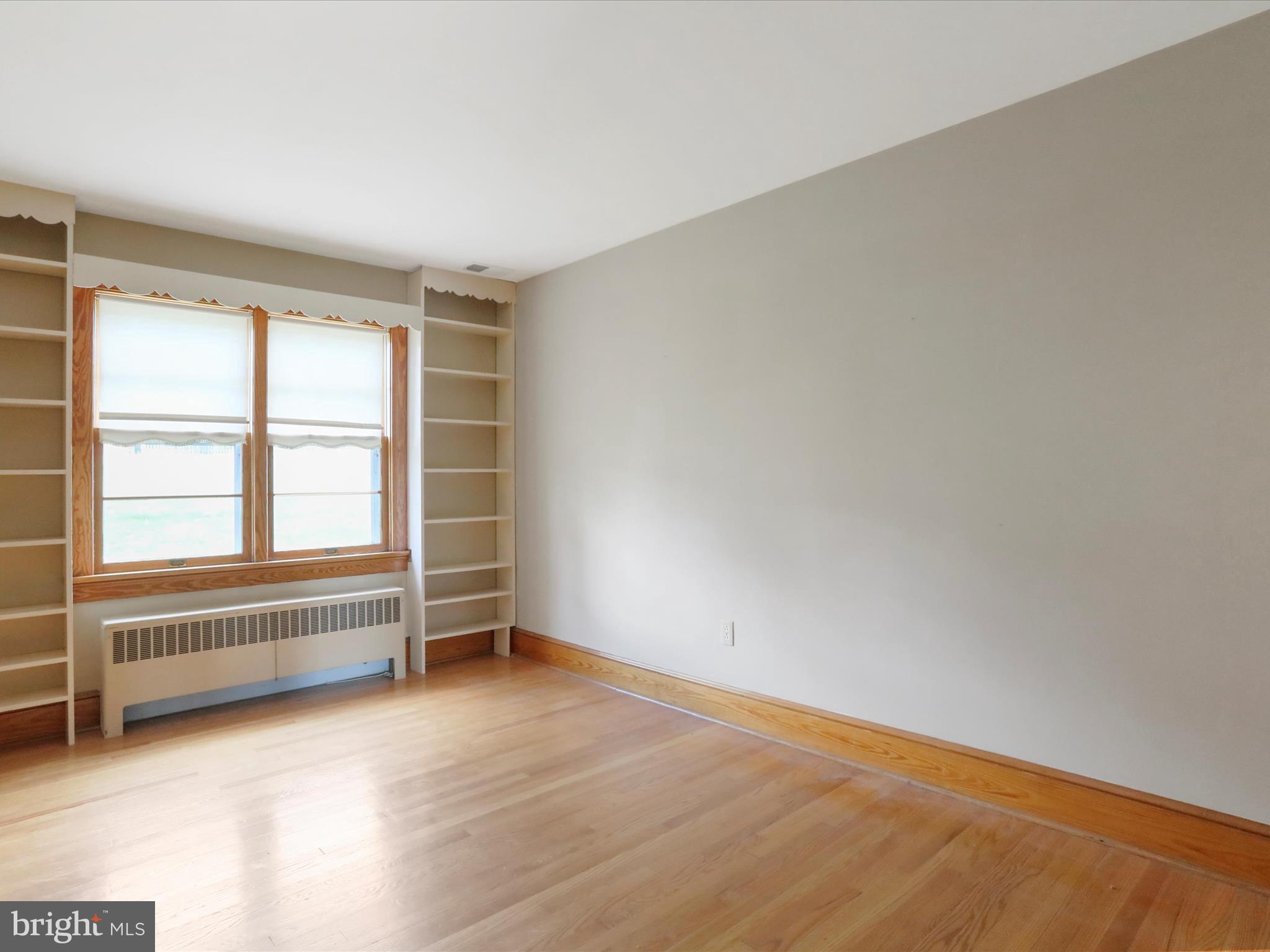 211 Broad Street Middletown, MD 21769 - Photo 19 of 35 wooden floor in an empty room with a window