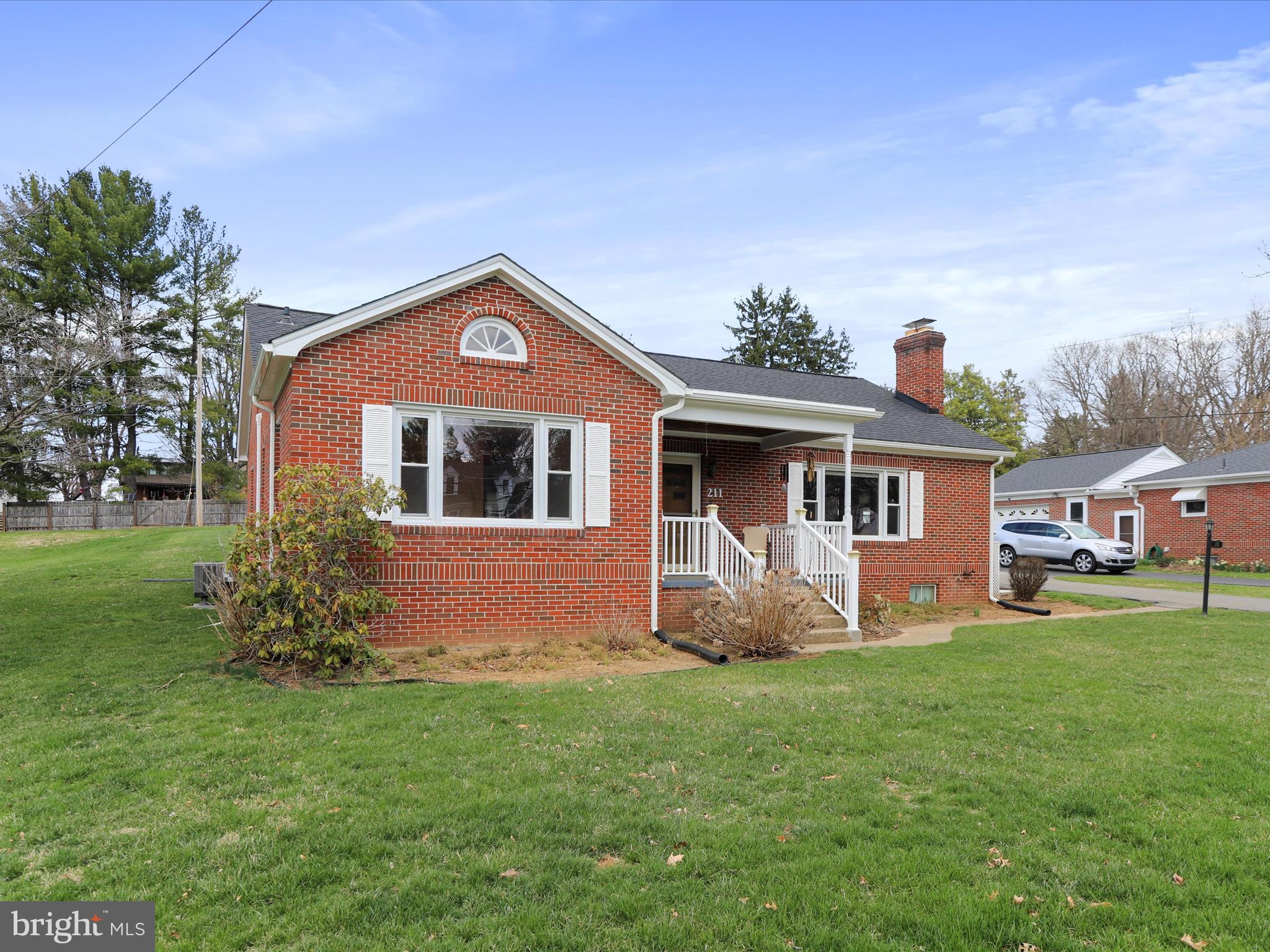 211 Broad Street Middletown, MD 21769 - Photo 2 of 35 a front view of house with yard and green space