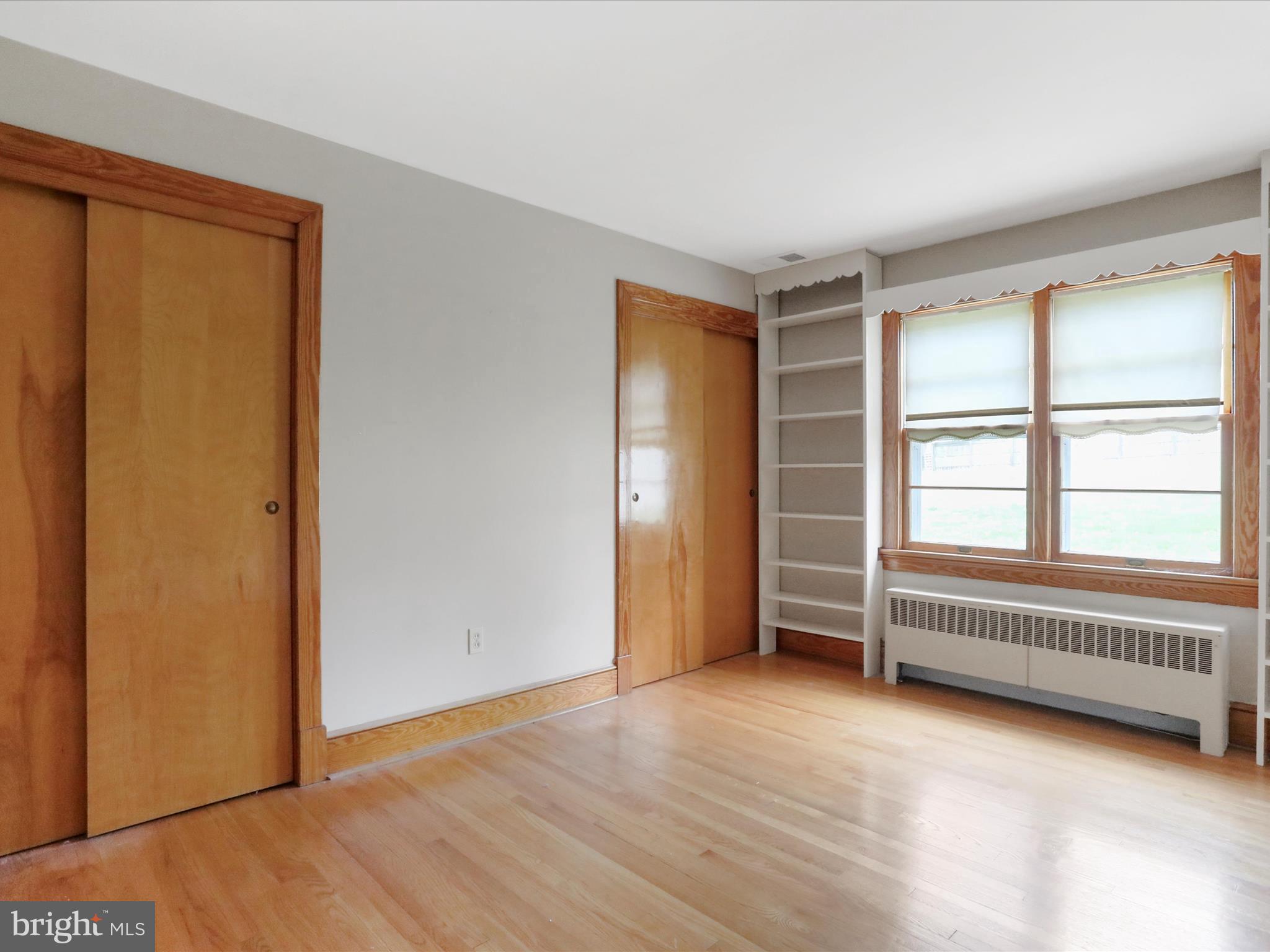 211 Broad Street Middletown, MD 21769 - Photo 21 of 35 an empty room with a hardwood and a window