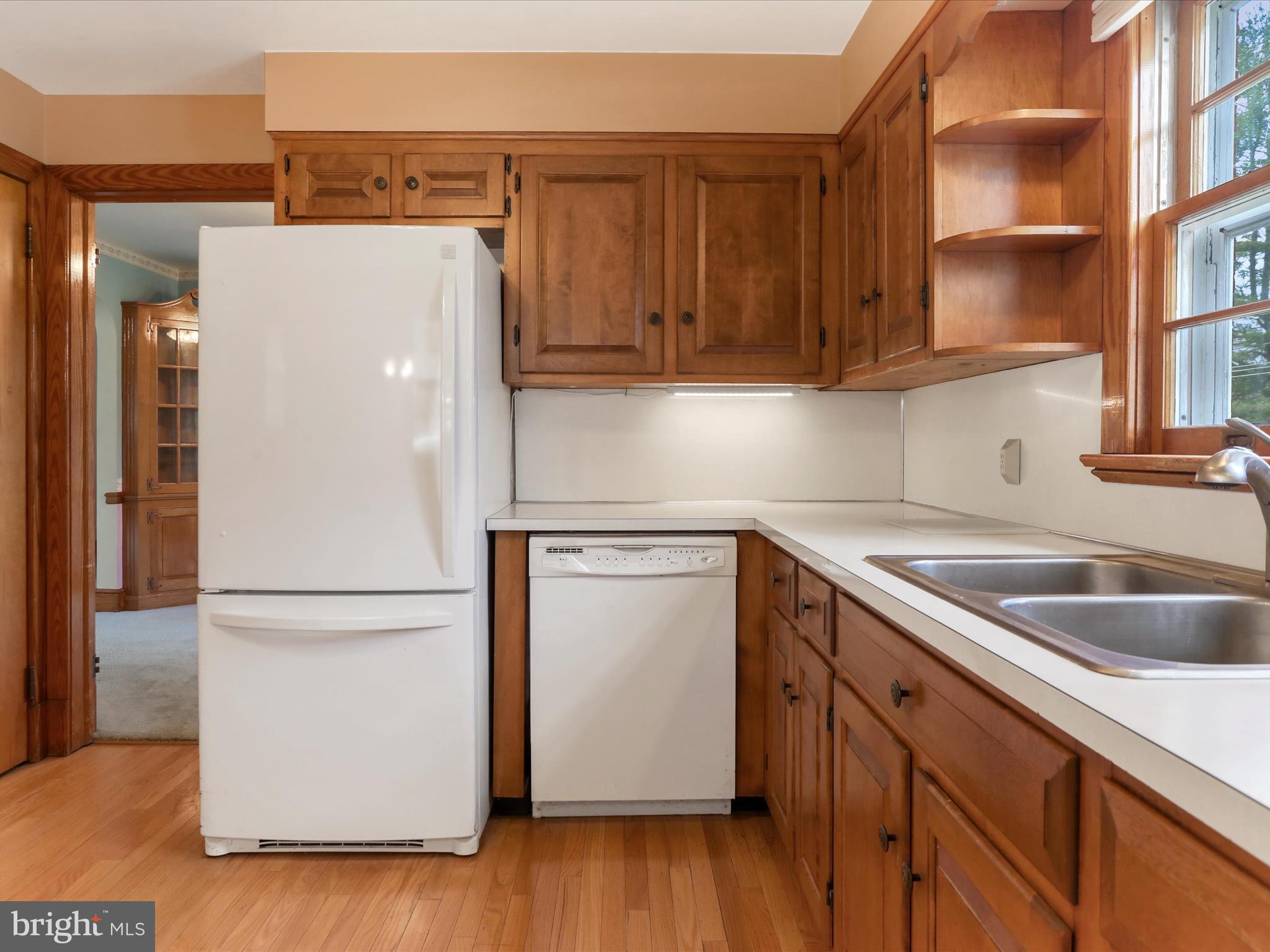 211 Broad Street Middletown, MD 21769 - Photo 25 of 35 a kitchen with a refrigerator sink and cabinets