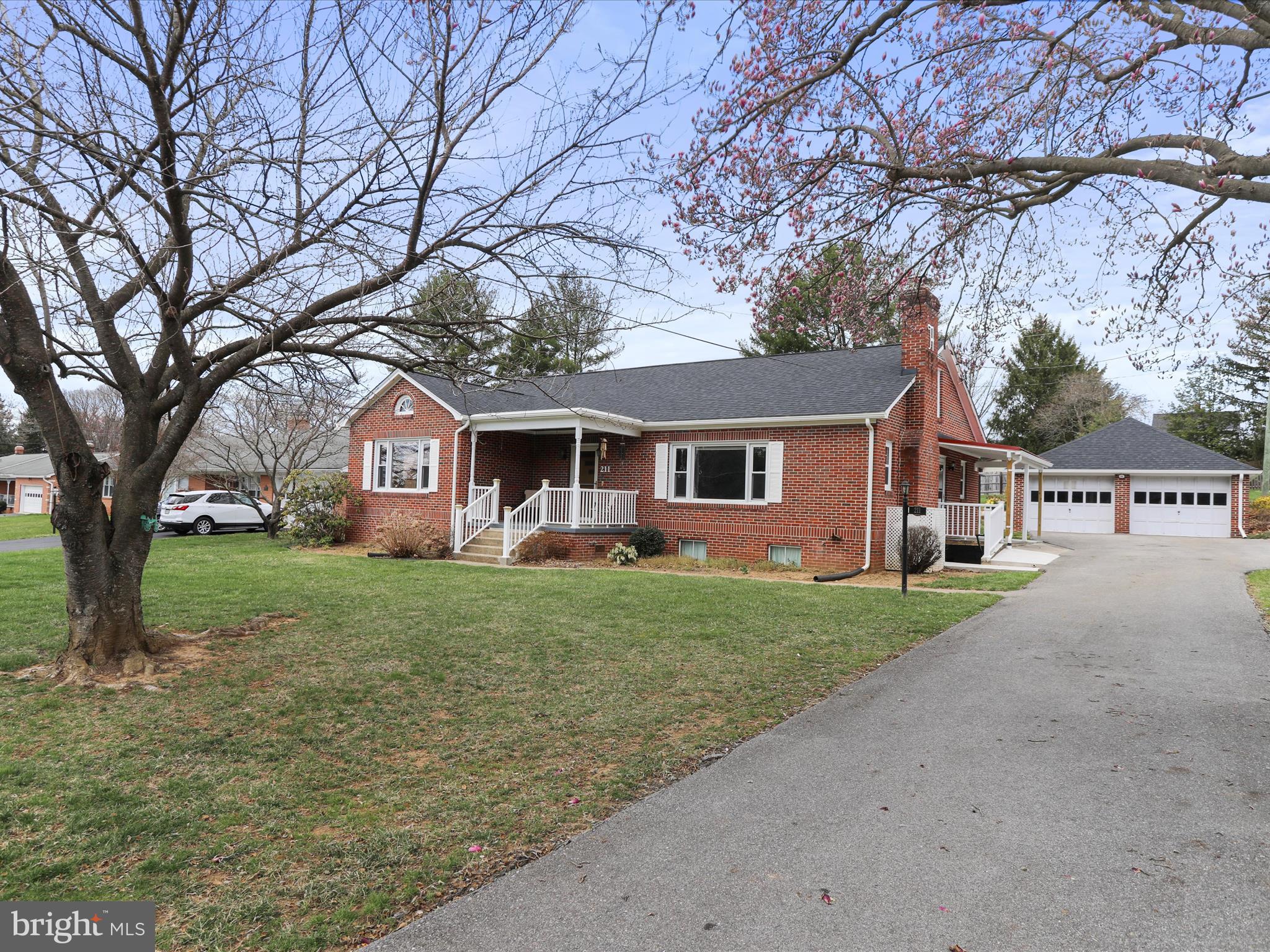 211 Broad Street Middletown, MD 21769 - Photo 3 of 35 a front view of a house with garden