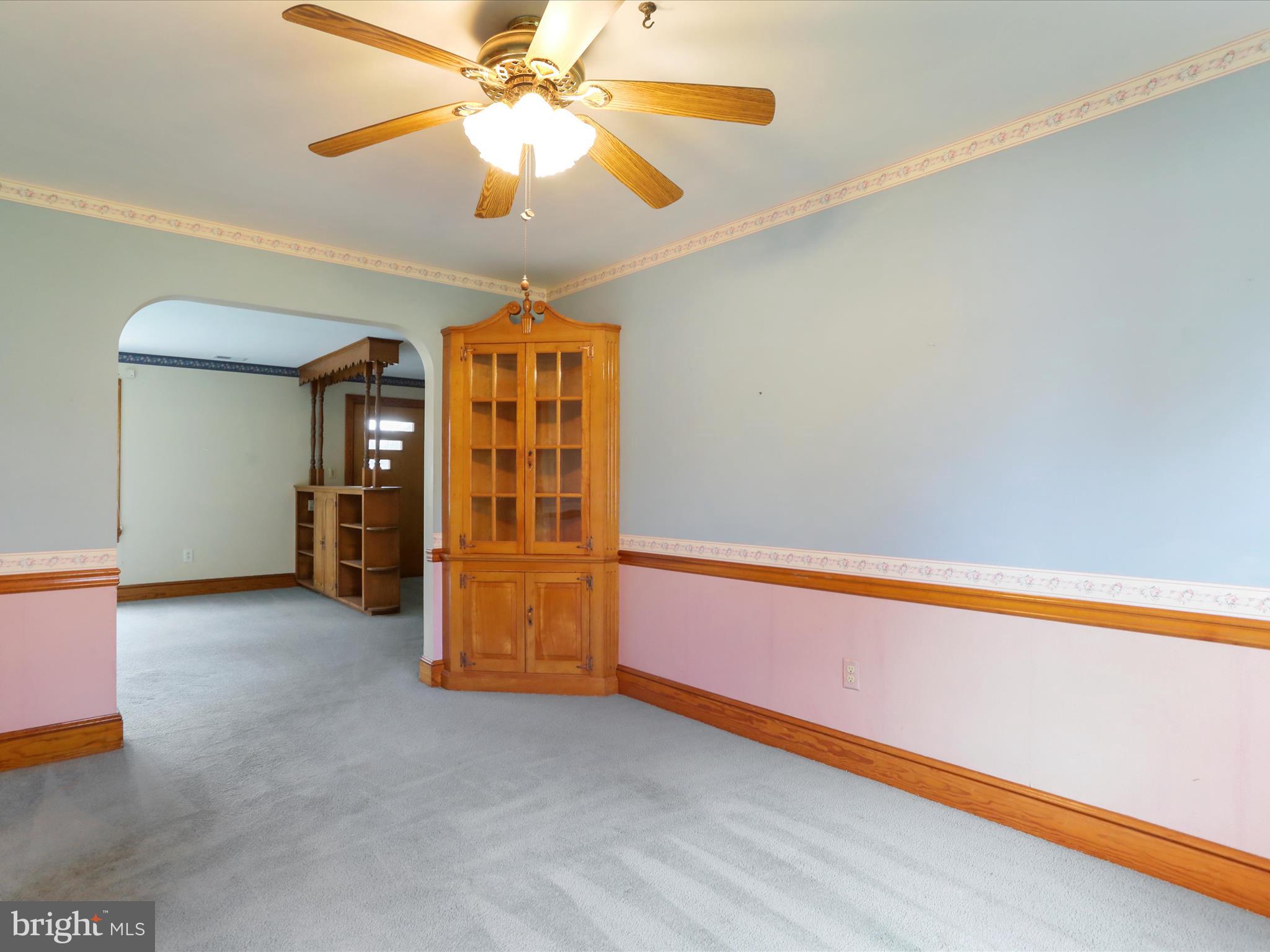 211 Broad Street Middletown, MD 21769 - Photo 6 of 35 a view of an empty room with a window
