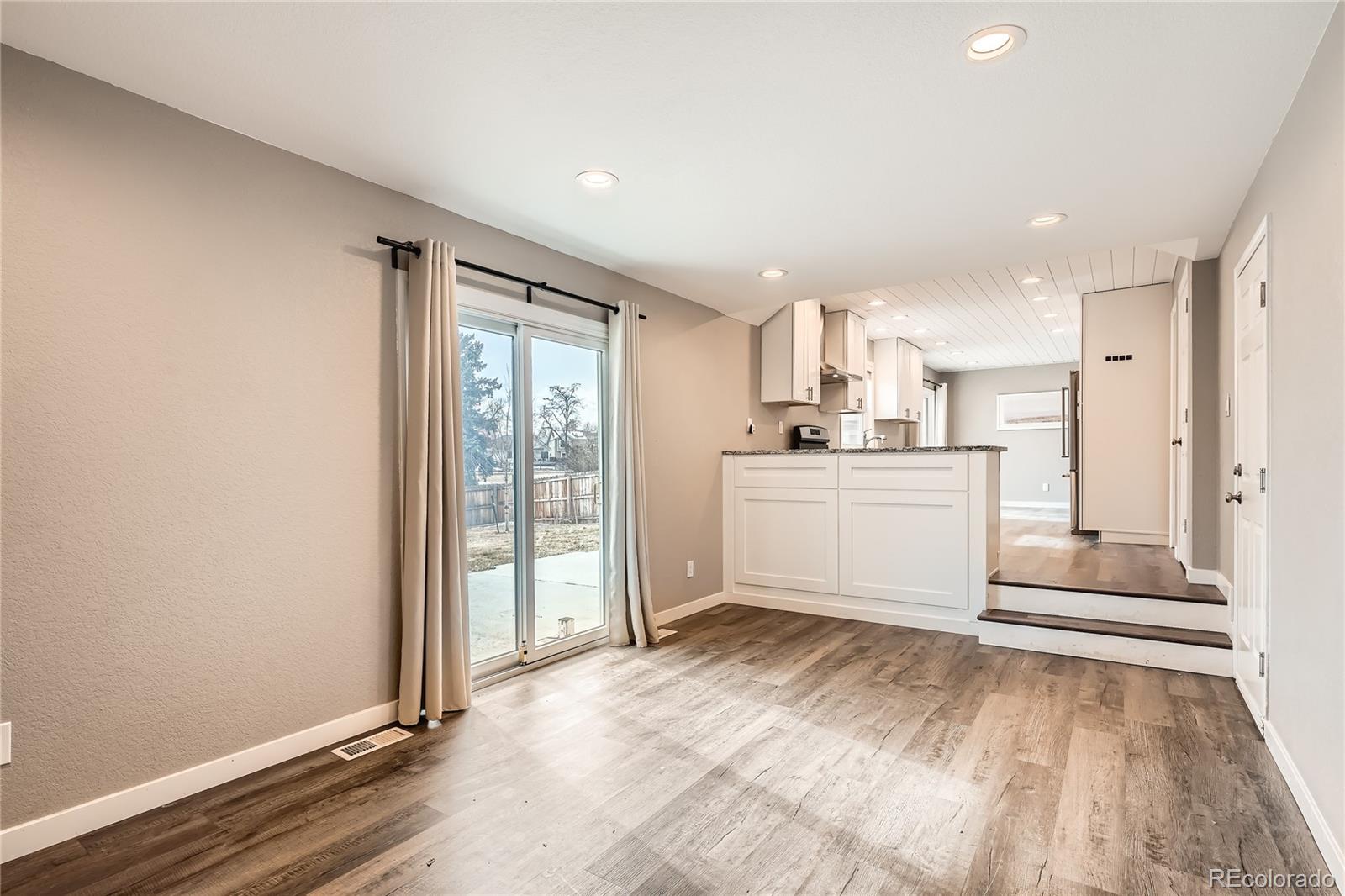 13158 West 62nd Drive Arvada, CO 80004 - Photo 19 of 35 a kitchen with a refrigerator and window