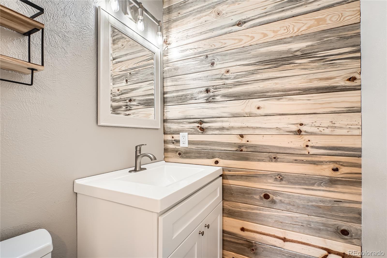 13158 West 62nd Drive Arvada, CO 80004 - Photo 20 of 35 a bathroom with a sink and a toilet