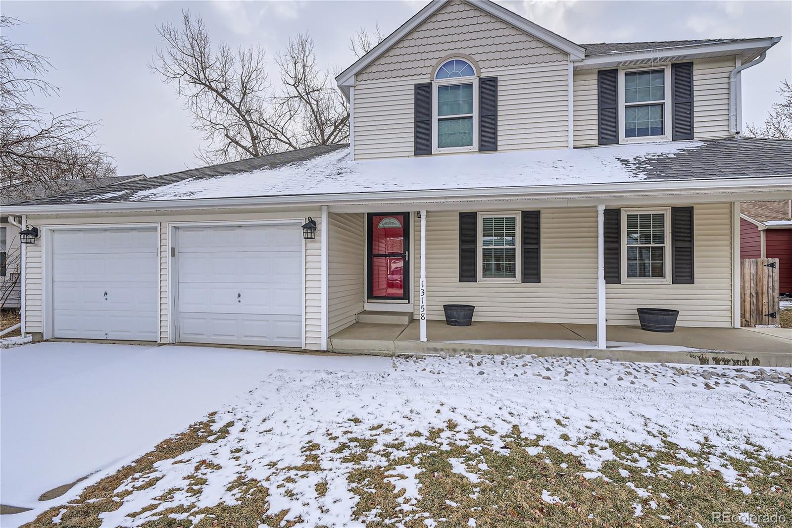 13158 West 62nd Drive Arvada, CO 80004 - Photo 3 of 35 a house with trees in front of it