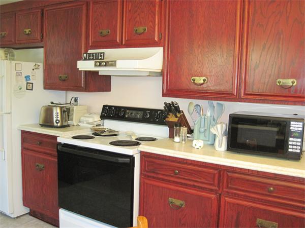 34 Evergreen Road Natick, MA 01760 - Photo 2 of 10 a kitchen with stainless steel appliances granite countertop a stove and a microwave oven