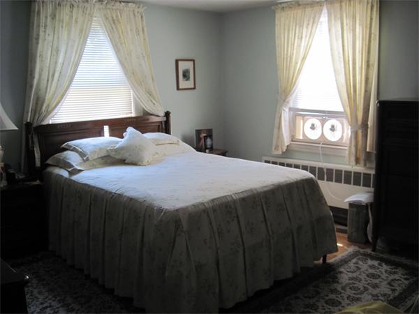 34 Evergreen Road Natick, MA 01760 - Photo 6 of 10 a bedroom with a bed and a window