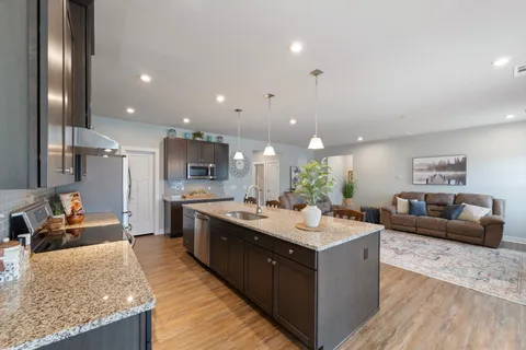 a bedroom with a bed and a ceiling fan