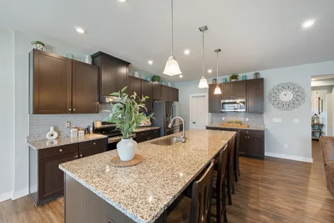 a spacious bathroom with a double vanity sink and a mirror