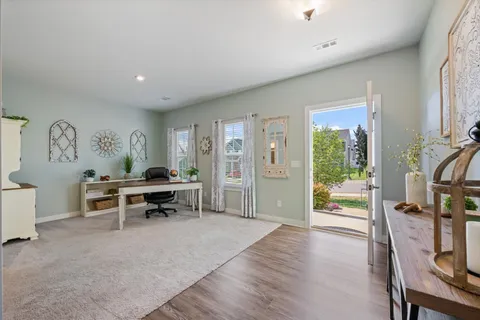 a living room with furniture fireplace and a flat screen tv