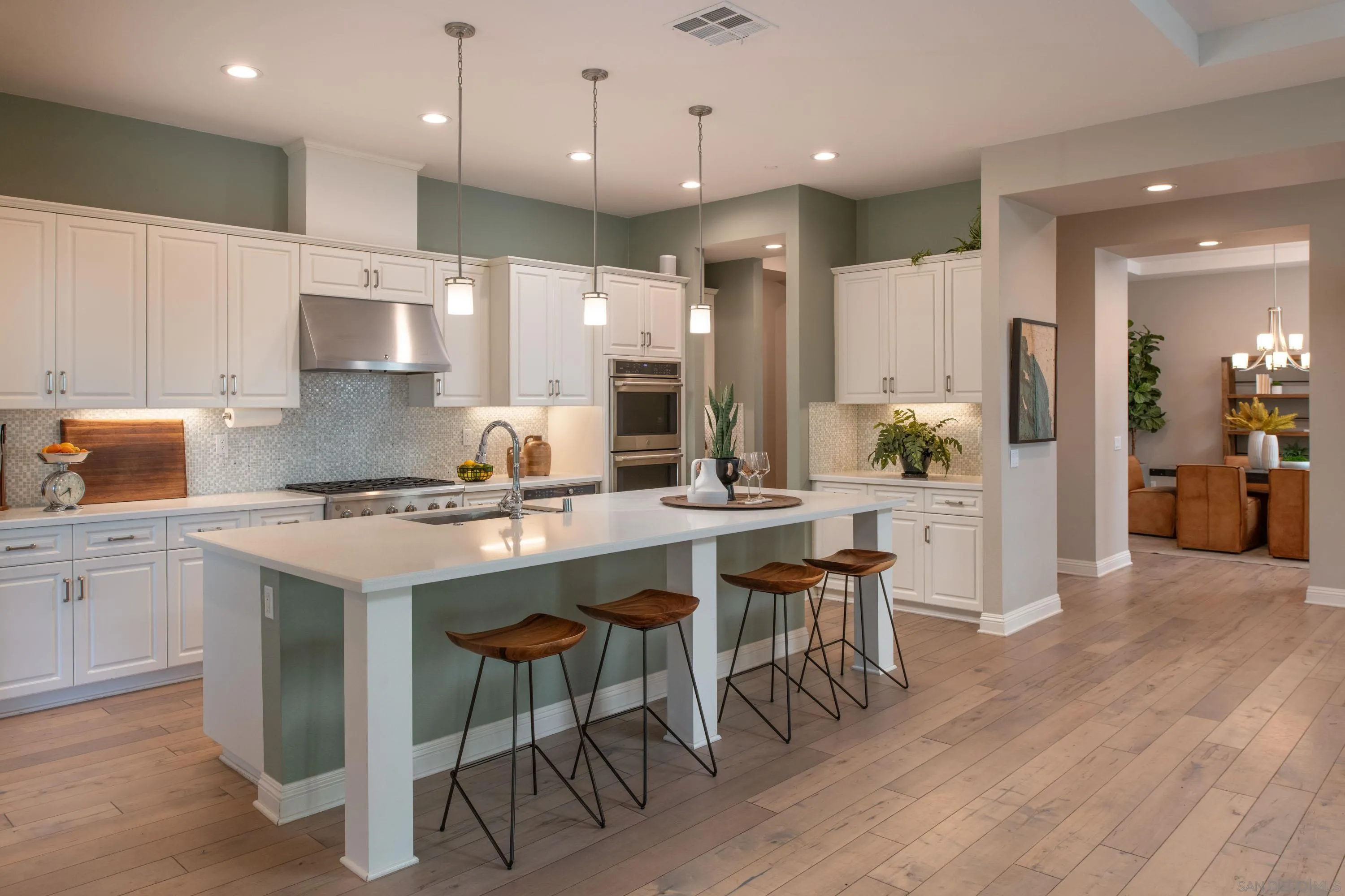 14516 Highcrest Court Poway, CA 92064 - Photo 14 of 71 a kitchen with a sink a stove a refrigerator and chairs