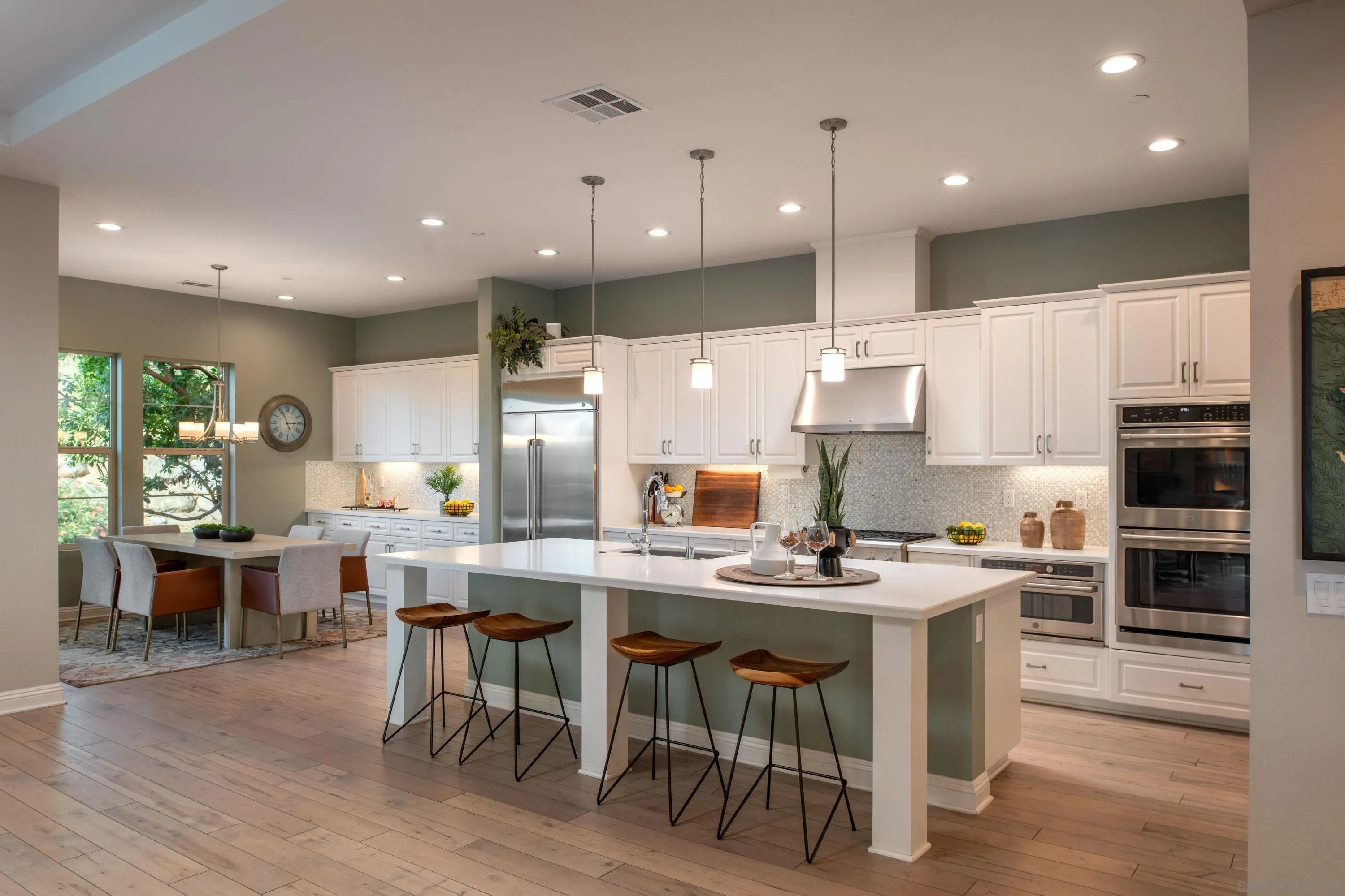 14516 Highcrest Court Poway, CA 92064 - Photo 17 of 71 a kitchen with stainless steel appliances kitchen island granite countertop a stove a sink a dining table and chairs