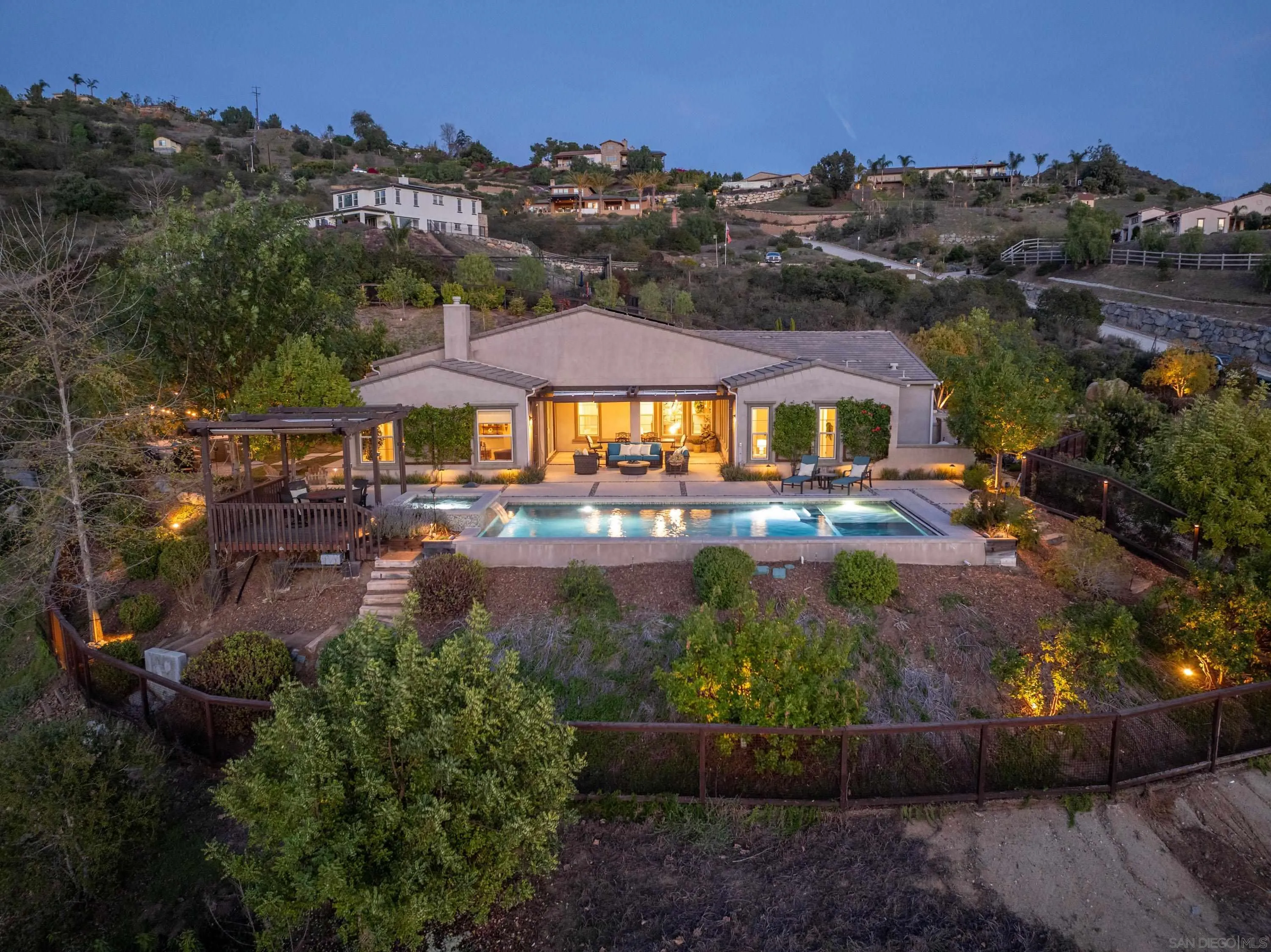 14516 Highcrest Court Poway, CA 92064 - Photo 2 of 71 an aerial view of a house with a garden and lake view