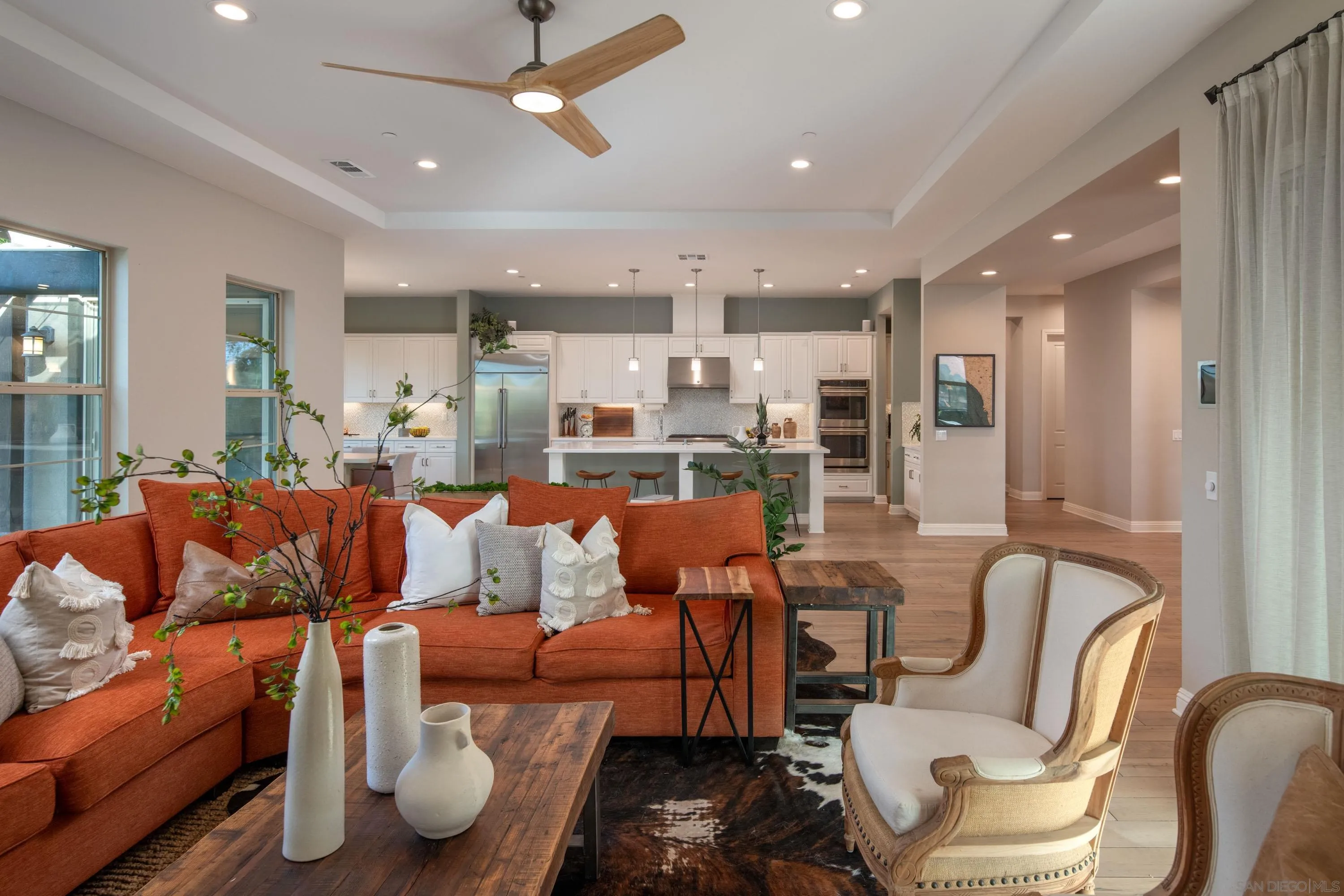 14516 Highcrest Court Poway, CA 92064 - Photo 21 of 71 a living room with furniture kitchen view and a chandelier