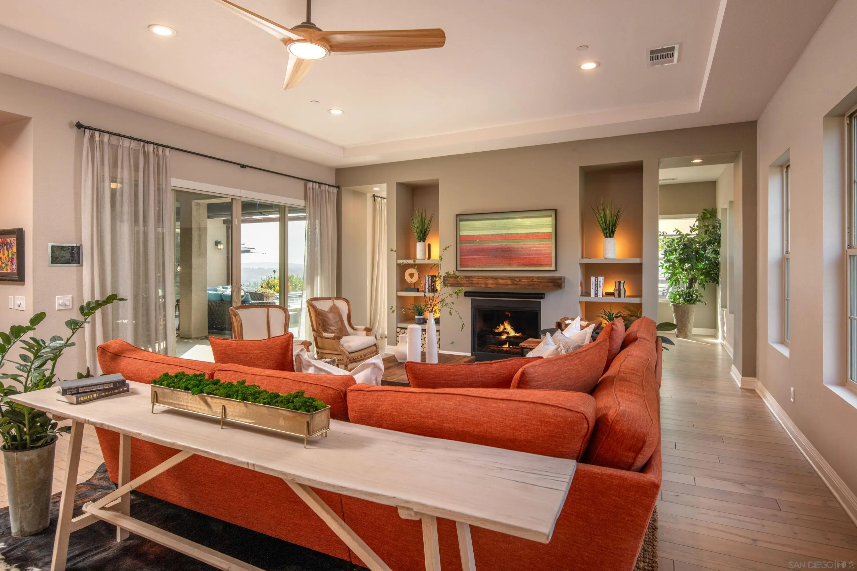14516 Highcrest Court Poway, CA 92064 - Photo 22 of 71 a living room with furniture a fireplace and a large window
