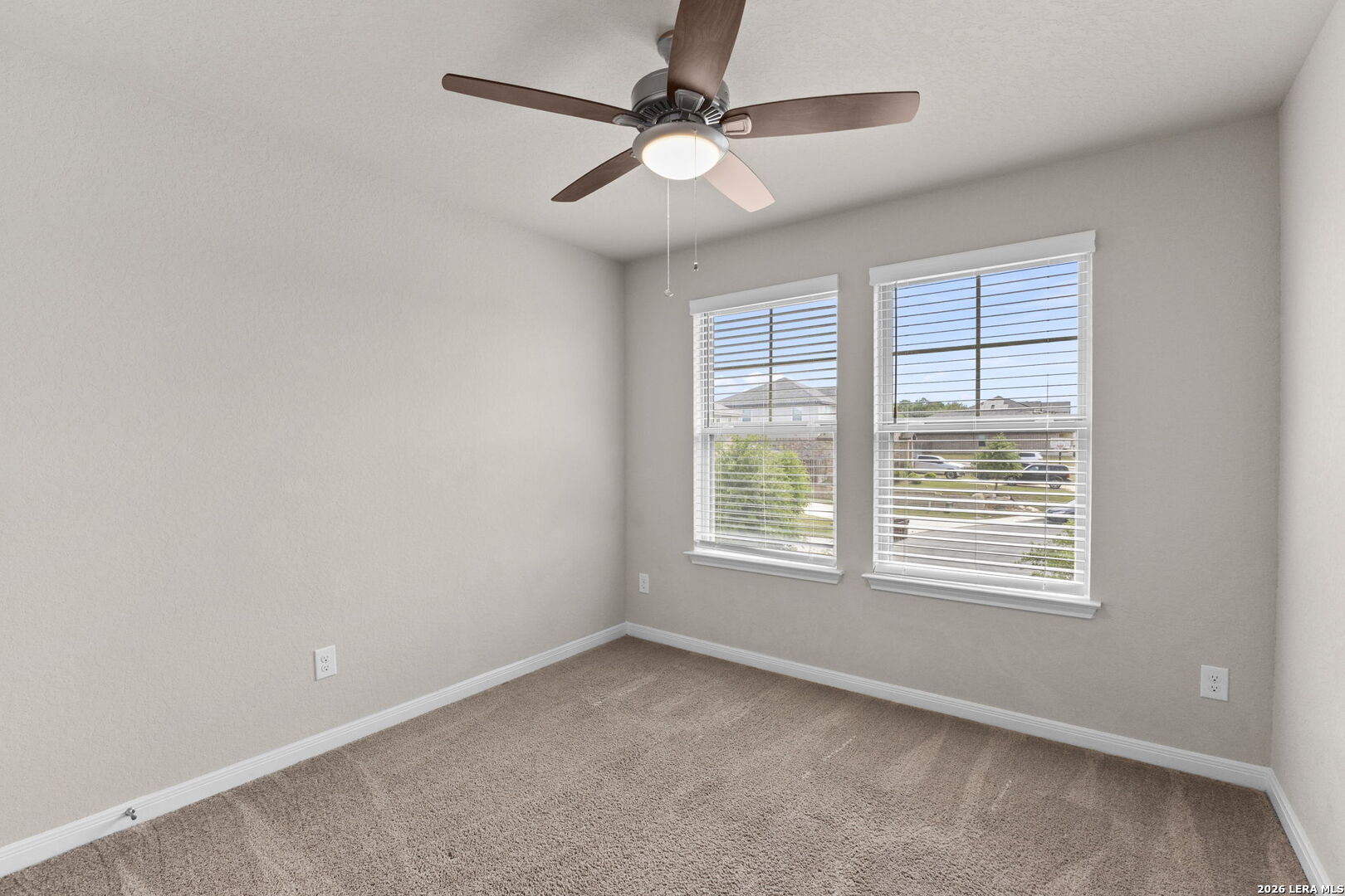 12221 Icon Ridge San Antonio, TX 78253 - Photo 24 of 46 an empty room with windows and fan