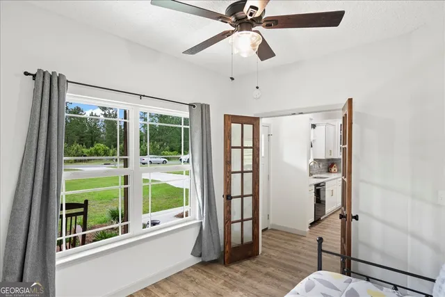a living room with furniture and a window