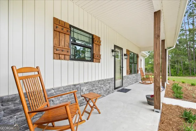 a large kitchen with a table and chairs