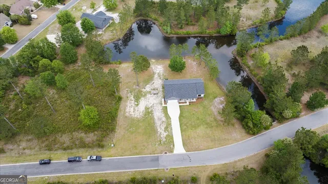 a view of a fountain in front of a house
