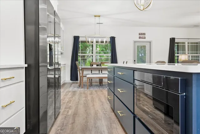 a workspace with furniture window and wooden floor