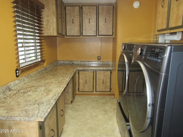 a view of a swimming pool with a lawn chairs