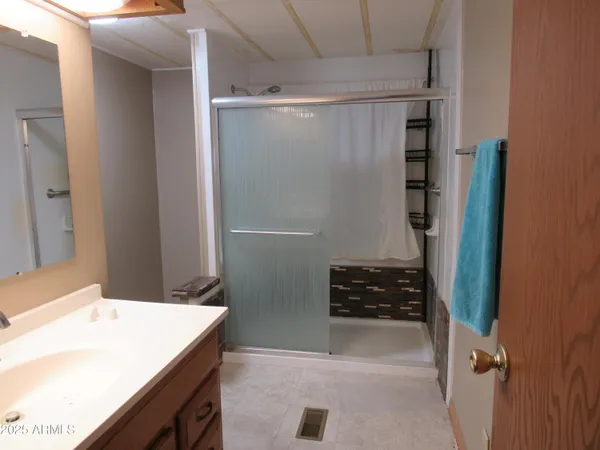 a bathroom with a shower and a stove