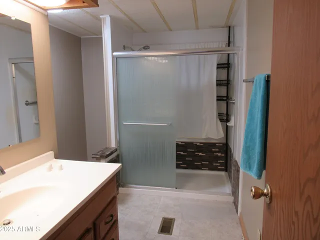 a bathroom with a shower and a stove