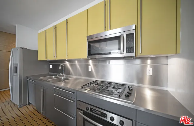 a view of a hallway with furniture and a floor to ceiling window
