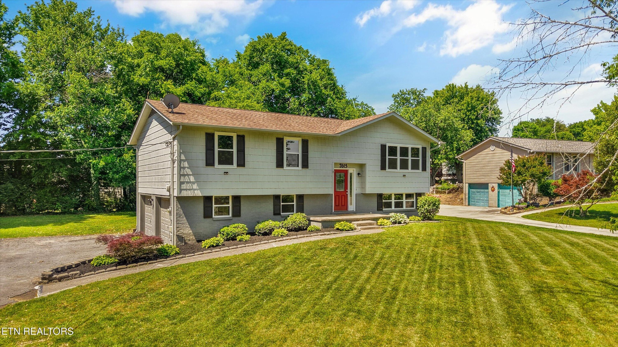 7613 Fall Wind Court Powell, TN 37849 - Photo 4 of 38 a view of a house with swimming pool and a yard