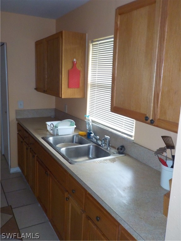 16981 First Street Alva, FL 33920 - Photo 6 of 12 a bathroom with a sink and a large mirror