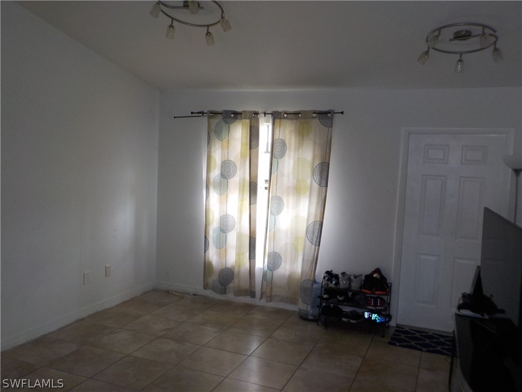 16981 First Street Alva, FL 33920 - Photo 7 of 12 a view of a room with toys and a window