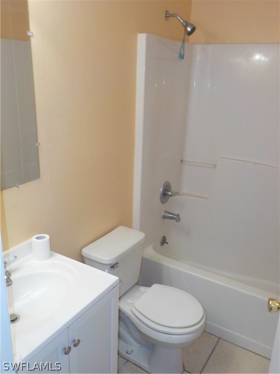 16981 First Street Alva, FL 33920 - Photo 8 of 12 a white toilet sitting next to a bath tub