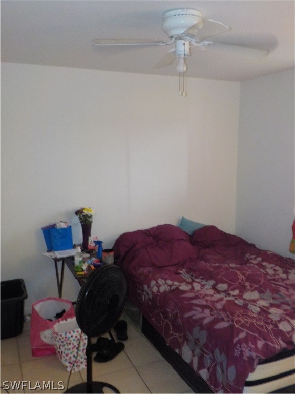 16981 First Street Alva, FL 33920 - Photo 9 of 12 a bed sitting in a bedroom next to a window