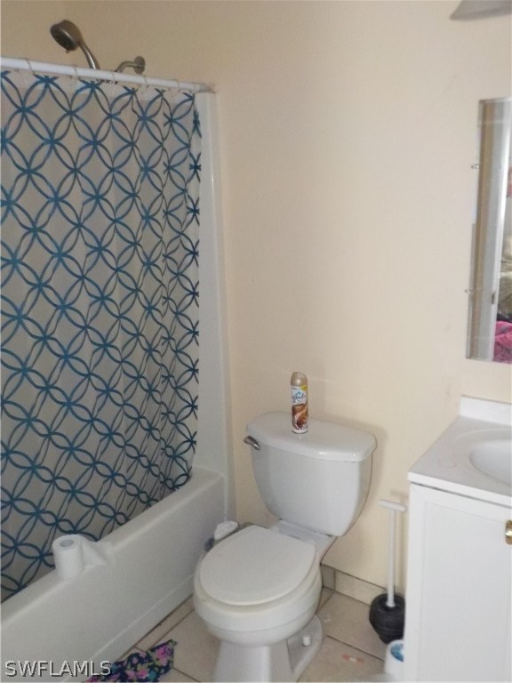 16981 First Street Alva, FL 33920 - Photo 10 of 12 a white toilet sitting next to a bathroom sink