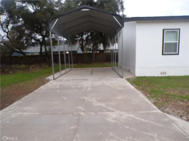 a view of a backyard of the house