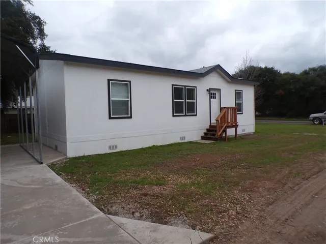 a view of a porch with wooden fence